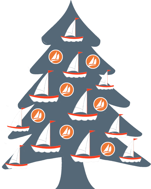 Christmas tree with toy boats and Crowley Marine logo balls on it